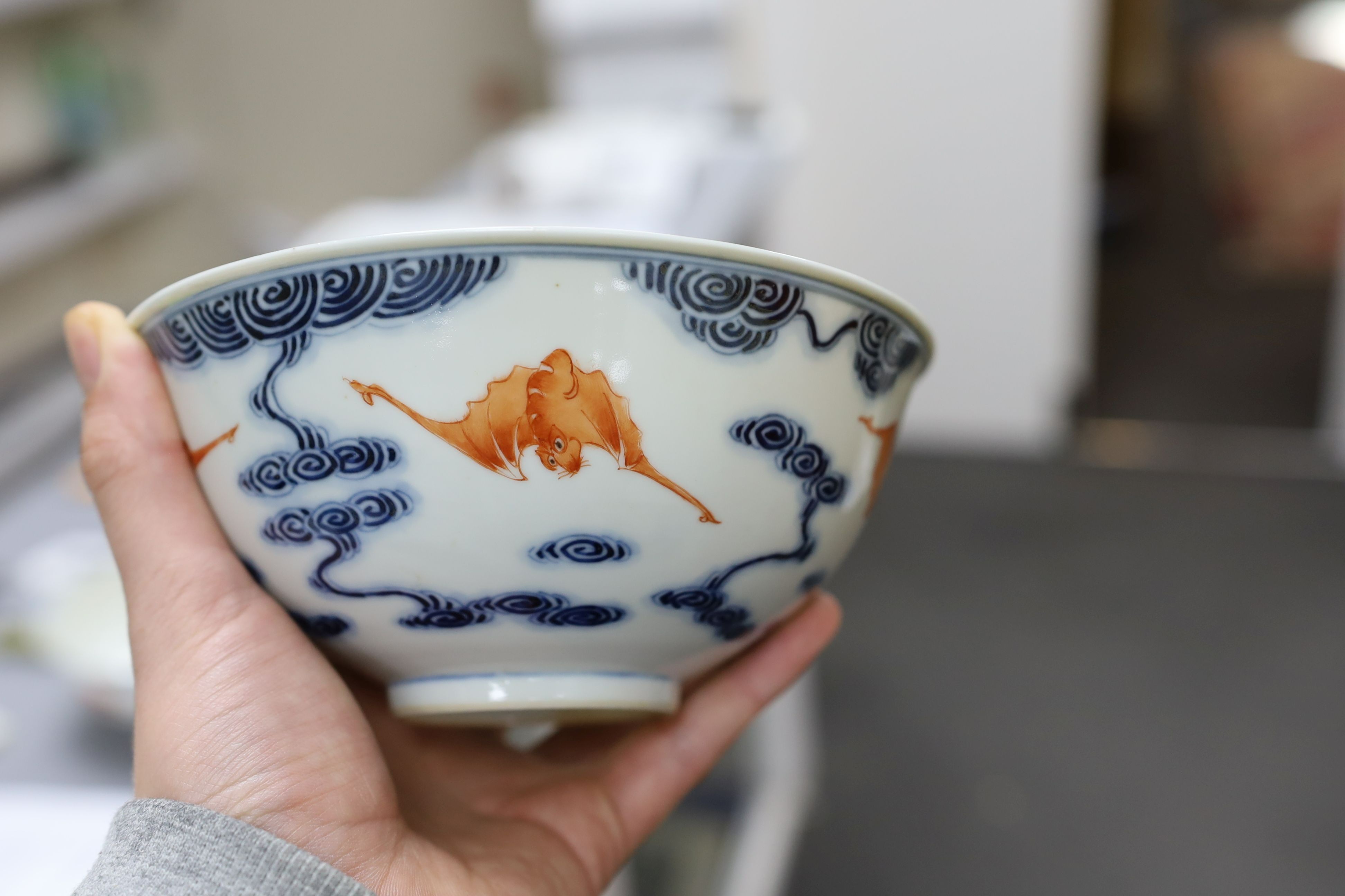 A pair of Chinese iron red and underglaze blue ‘five bat’ bowls, Guangxu mark and probably of the period (1875-1908), 16.5cm diameter